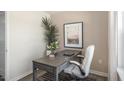 Bright home office features a desk, chair, and large artwork at 8658 Brixton Shay Dr, Raleigh, NC 27616
