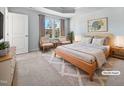 Spacious bedroom with wood bed frame and neutral decor at 901 Arnold Place Dr, Fuquay Varina, NC 27526