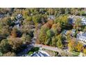 Aerial view of a large wooded lot surrounded by homes at 906 Marlowe Rd, Raleigh, NC 27609
