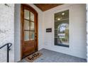 Elegant front entry with arched wooden door and sidelight at 1409 Sedgefield St, Durham, NC 27705