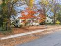 Ranch home with mature trees and fall foliage at 307 Bickett Blvd, Raleigh, NC 27608