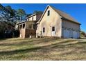 Two-story home with attached two-car garage and expansive yard at 340 Cedar Grove Dr, Henderson, NC 27537