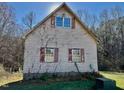 Rustic shed with ivy and red shutters at 340 Cedar Grove Dr, Henderson, NC 27537