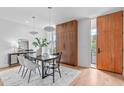 Modern dining room with wood table and chairs, hardwood floors at 511 S Bloodworth St # 103, Raleigh, NC 27601