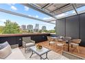 Spacious rooftop deck with city views and outdoor furniture at 511 S Bloodworth St # 103, Raleigh, NC 27601