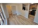 Open concept dining area and kitchen with light flooring at 667 Bashford Rd, Raleigh, NC 27606