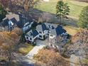 Luxury home situated on a golf course community with mature trees at 1309 Briar Patch Ln, Raleigh, NC 27615