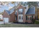Attractive two-story brick home with a two-car garage and well-manicured lawn at 3100 Lariat Ridge Dr, Wake Forest, NC 27587