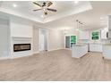 Open concept kitchen with white cabinets, granite counters, and island at 652 Shawnee Dr, Louisburg, NC 27549