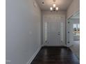 Bright entryway with dark hardwood floors and modern door at 51 Sunburst Ct, Fuquay Varina, NC 27526