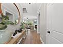 Bright entryway with wood floors and view into the living room at 517 Shawnee Dr, Louisburg, NC 27549