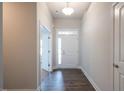 Welcoming entryway with wood floors and access to a bedroom at 54 Northwood Dr, Fuquay Varina, NC 27526