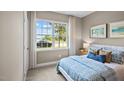 Spacious bedroom with large window and neutral decor at 40 Saddle Mare St, Clayton, NC 27520