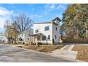 Two story modern home with white siding, and a small deck at 2503 Lednum St, Durham, NC 27704