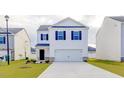 Two-story house with white siding,navy blue shutters, and a two-car garage at 2541 Lily Dr # 188, Haw River, NC 27258