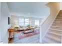 Spacious living room with large windows, comfortable seating, and a neutral color scheme at 2541 Lily Dr # 188, Haw River, NC 27258