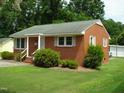 Red brick ranch house with a spacious yard at 608 N Ellis Ave, Dunn, NC 28334