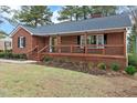 Newly renovated brick ranch house with a spacious front porch at 303 Forest Rd, Oxford, NC 27565
