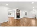 Spacious living room with hardwood floors and a stone fireplace at 303 Forest Rd, Oxford, NC 27565