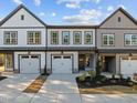 Three townhouses showcasing modern farmhouse exterior design at 507 Excelsior Ct, Rolesville, NC 27587