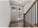 Bright entryway with hardwood floors and staircase at 509 Excelsior Ct, Rolesville, NC 27587