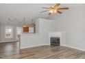 Living room features a fireplace and vaulted ceilings at 113 S Friars Chase Ln, Fuquay Varina, NC 27526