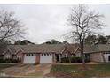 Front view of charming townhome with two-car garage at 11321 Involute Pl # 102, Raleigh, NC 27617