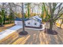 Aerial view of charming ranch home with tree-lined street at 2804 Edgewood Ave, Burlington, NC 27215