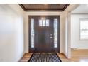 Inviting entryway with modern door and hardwood floors at 2804 Edgewood Ave, Burlington, NC 27215