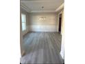 Spacious dining room with wainscoting and hardwood floors at 115 Lemon Drop Ln, Franklinton, NC 27525
