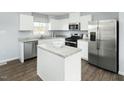 Modern kitchen featuring stainless steel appliances and an island at 129 Sunny Acres Rd, Raleigh, NC 27603