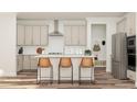 Modern kitchen with light cabinets, quartz countertops, and an island with seating at 1204 Coral Cay Bnd, Wake Forest, NC 27587