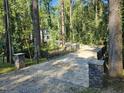 Private gated driveway leading to a two-story house at 3544 Bryn Mawr Ct, Raleigh, NC 27606