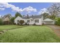 White house with carport, and spacious lawn at 507 E Davis St, Smithfield, NC 27577
