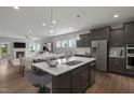 Modern kitchen with island, stainless steel appliances, and open floor plan at 72 Macy Circle, Wendell, NC 27591