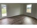 Bright bonus room with a door leading to the backyard at 130 Tulipfield Way, Benson, NC 27504