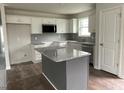 Modern kitchen with granite countertops and an island at 130 Tulipfield Way, Benson, NC 27504