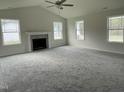 Spacious living room featuring a fireplace and large windows at 130 Tulipfield Way, Benson, NC 27504