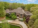 Impressive brick home with landscaped grounds and driveway at 32520 Archdale Dr, Chapel Hill, NC 27517