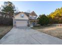 Two-story house with gray siding, brown accents, and a long driveway at 333 Bald Head Island Dr, Garner, NC 27529