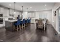 Open concept kitchen with island seating and dining area at 604 Mohinda Way, Willow Springs, NC 27592