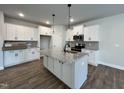 Spacious kitchen featuring granite island and stainless steel appliances at 91 Calluna Dr, Clayton, NC 27520