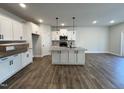 Open concept kitchen with granite countertops and island at 91 Calluna Dr, Clayton, NC 27520