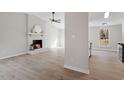 Bright living room with fireplace, hardwood floors, and lots of natural light at 107 Crystal Ct, Cary, NC 27513