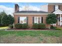 Landscaped brick home with walkway at 113 Granby Ct, Cary, NC 27511