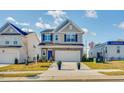 Two-story house with a neutral color palette and a two-car garage at 167 S Finley Landing Pkwy, Smithfield, NC 27577