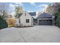 Attached garage with large driveway and basketball court at 3319 Milton Rd, Raleigh, NC 27609