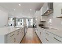 Modern kitchen featuring white cabinets, island, and stainless steel appliances at 510 Village Branch Ln # 45, Wake Forest, NC 27587