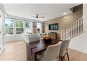 Elegant dining area with a modern table and chairs, adjacent to the living room at 604 Market Grove Dr # 100, Wake Forest, NC 27587