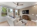Spacious living area with large windows, hardwood floors, and a cozy atmosphere at 604 Market Grove Dr # 100, Wake Forest, NC 27587